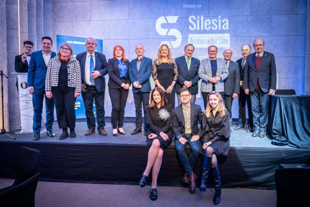 Group of people in business attire on stage